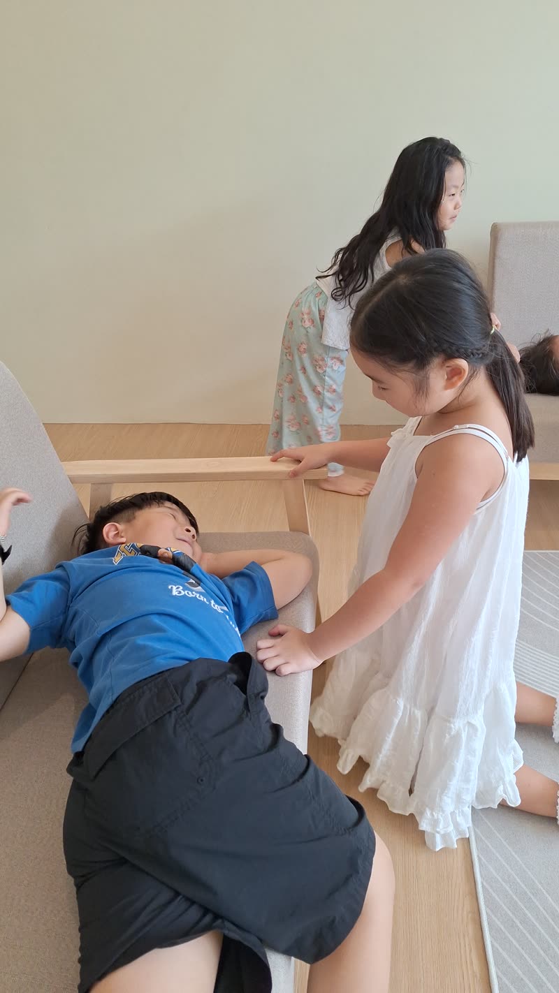 Children acting out a scene during drama class