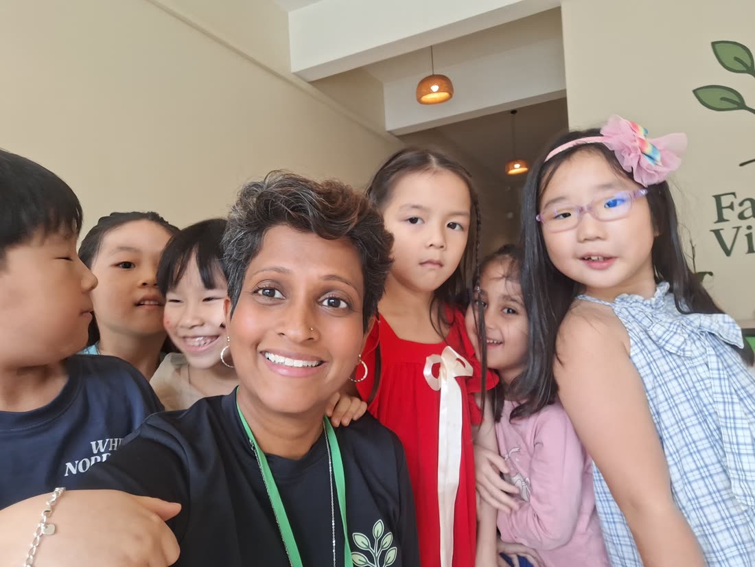 Melissa Gunadesa with children at The Family Village