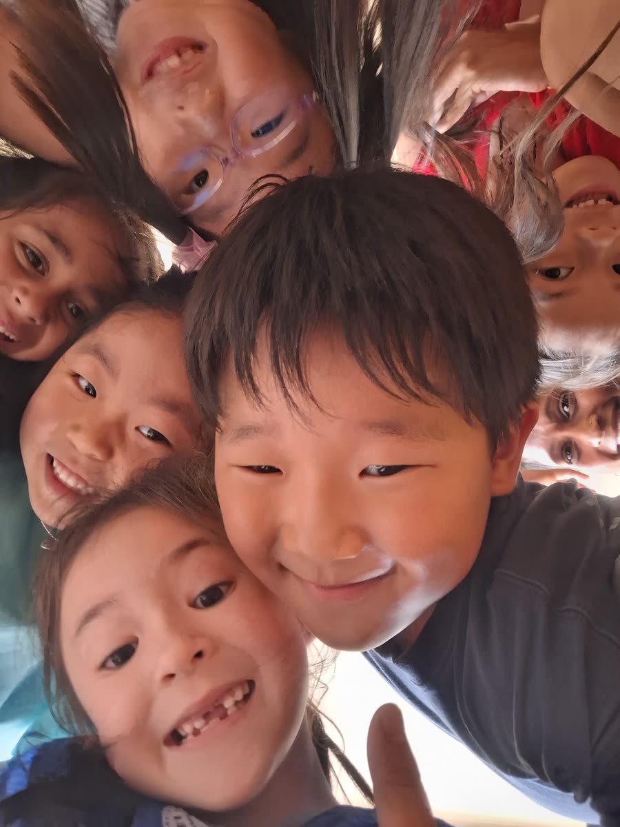 Children playing a drama game on the floor
